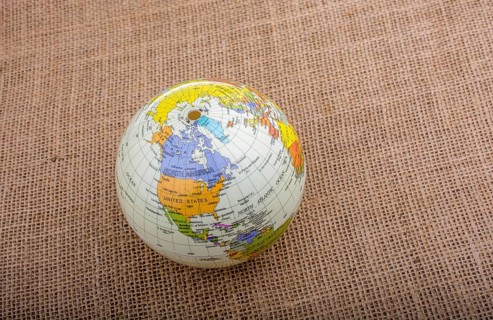 Globe placed on a brown fabric background