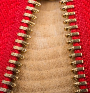 Closeup of a colorful zipper with metal teeth