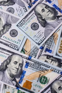 American 100 dollar banknotes made of paper placed on white background