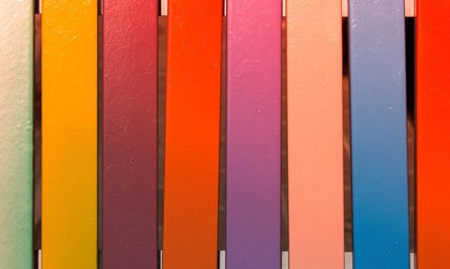Colorful vintage pattern background on wooden parquet planks