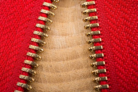 Closeup of a colorful zipper with metal teeth