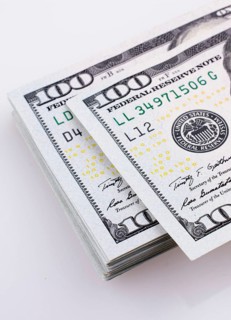 American 100 dollar banknotes made of paper placed on white background