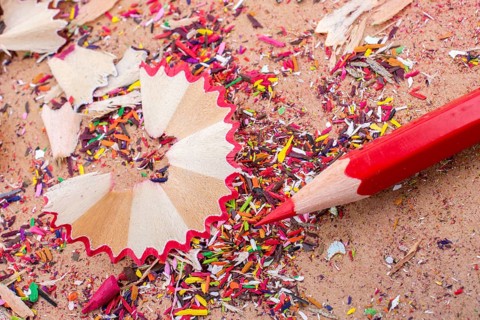 Red Color Pencil over some pencil shavings