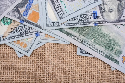 Banknote of US dollar placed on a linen canvas