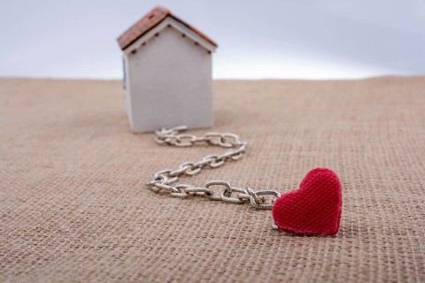 Model house and chain with a heart on canvas