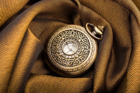 Mechanical retro styled pocket watch on fabric