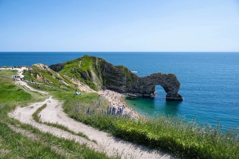 Walk along the chalk coast with the famous rock bridge Durdledoor