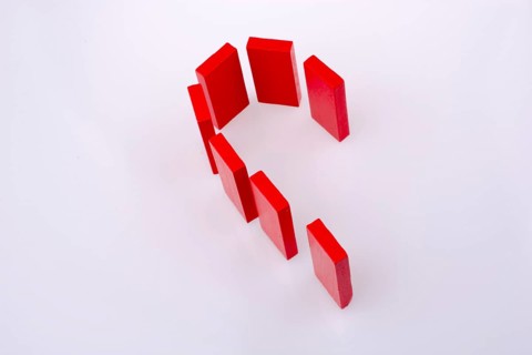 Half heart made of red dominoes