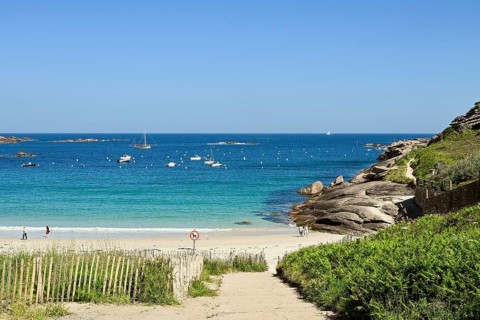 Bay with sandy beach and granite rocks