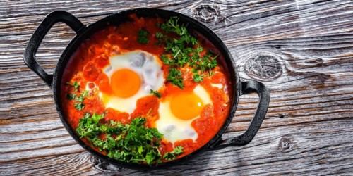 Shakshouka dish in a cast iron pan