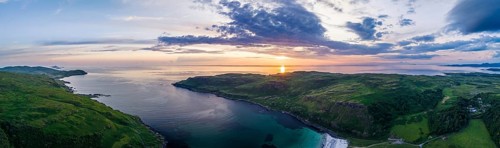 Panorama of Calgary Beach and Bay at sunset from a drone