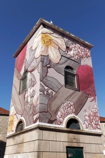 Transformer house painted with flower and plant motifs