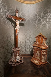 Devotional room with elaborate wooden and ivory crucifix and devotional altar with inlay work