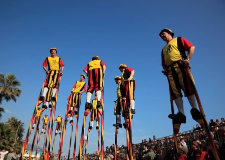 Stilt walkers in the street parade in Menton