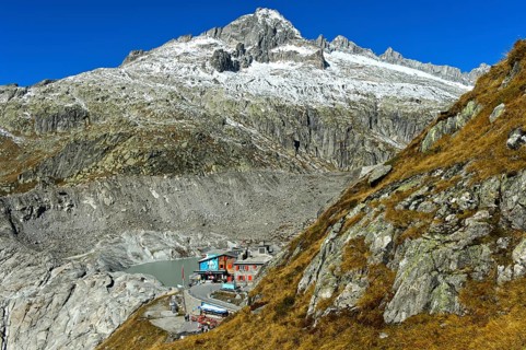 At the entrance to the ice grotto in the Rhone glacier