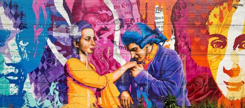 Brightly coloured graffiti on Lottehaus with Charlotte Buff and Johann Wolfgang von Goethe