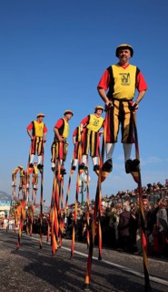 Stilt walkers in the street parade in Menton