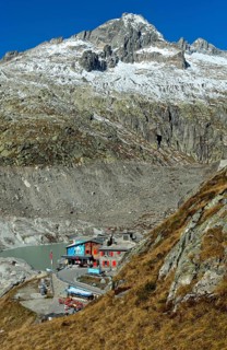 At the entrance to the ice grotto in the Rhone glacier