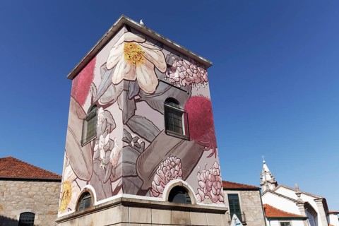 Transformer house painted with flower and plant motifs
