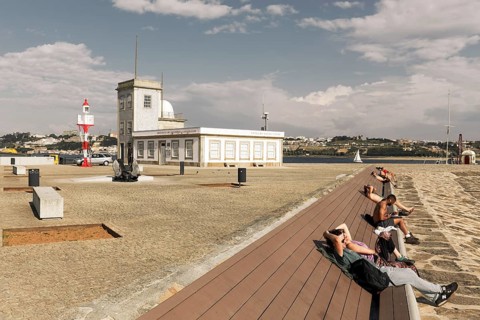People sunbathing on a bench at the lighthouse of Sao Miguel-O-Anjo