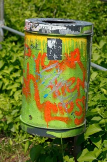 Colourfully painted metal wastepaper basket