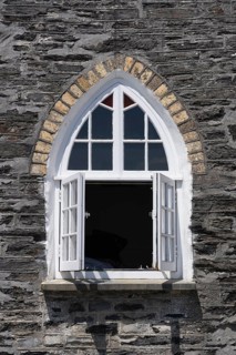 Gothic style windows on the former schoolhouse in Port Isaac
