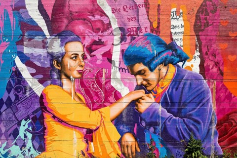 Brightly coloured graffiti on Lottehaus with Charlotte Buff and Johann Wolfgang von Goethe