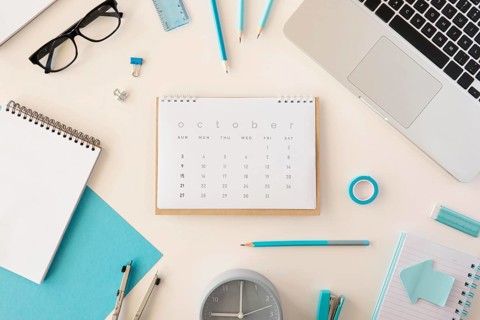Flat lay desk calendar blue office accessories