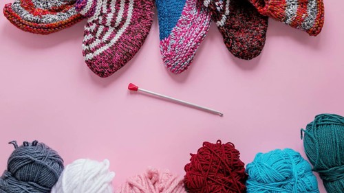 Top view knitting needles wool