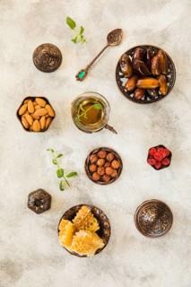 Tea glass with dates fruit nuts table