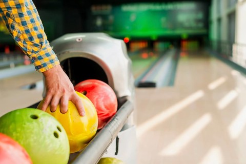 Person taking bowling ball