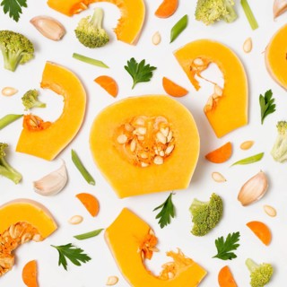 Top view organic pumpkin with broccoli table