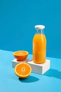 High angle orange juice bottle