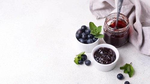 Delicious blueberry jam with copy space