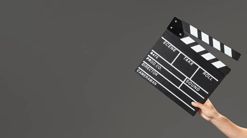 Hand with movie slate