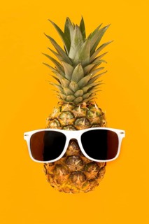 Top view exotic pineapple with sunglasses