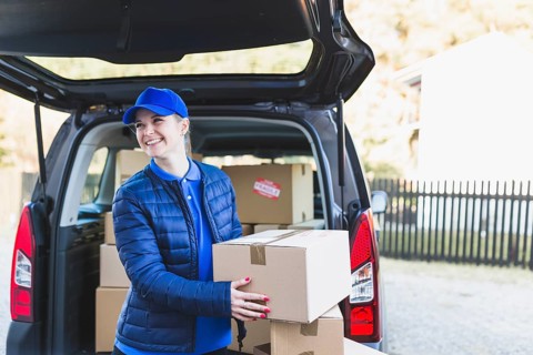Pretty woman working delivery service