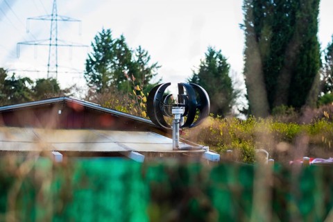 Small wind turbine on a roof of an allotment house in Duesseldorf