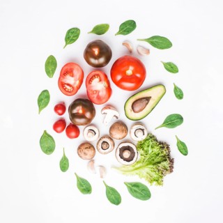 Spinach around vegetables mushrooms