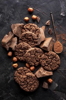 Top view chocolate cookies with hazelnuts cocoa powder