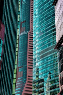 Details of close standing downtown buildings. Vertical lines