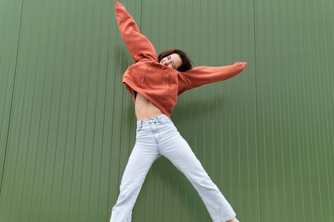 Portrait young beautiful female jumping 1