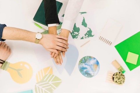 Group businesspeople stacking their hands desk