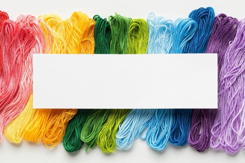 Colorful thread arrangement flat lay
