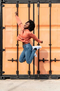 Portrait young female jumping 1