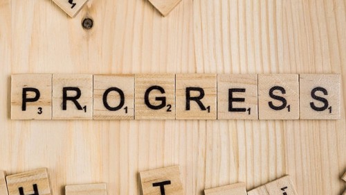Progress word wooden tiles