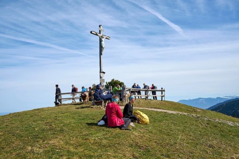 Hikers resting on the summit of Schwarzenberg