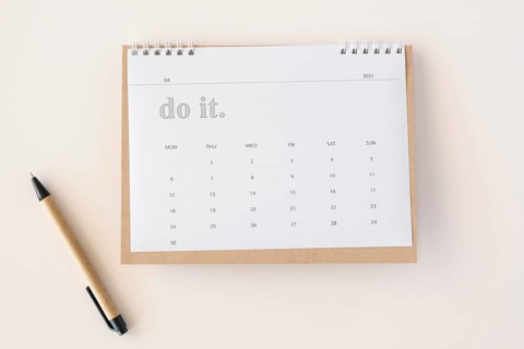 Flat lay planner calendar pen