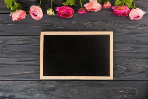 Rose flowers with big chalkboard wooden table