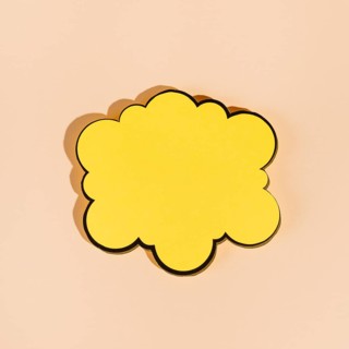 Empty yellow speech bubble beige background